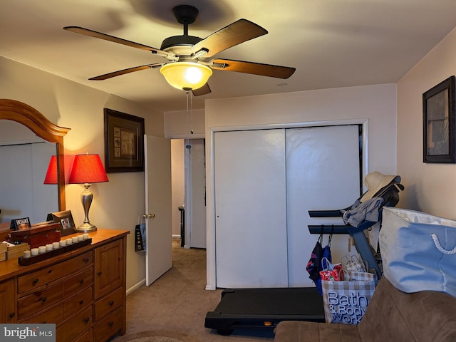 interior space with light carpet and ceiling fan