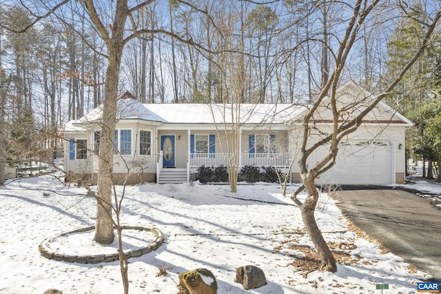 single story home with covered porch and a garage