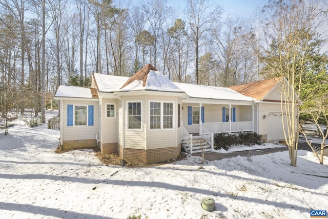 view of front of home with a garage and covered porch