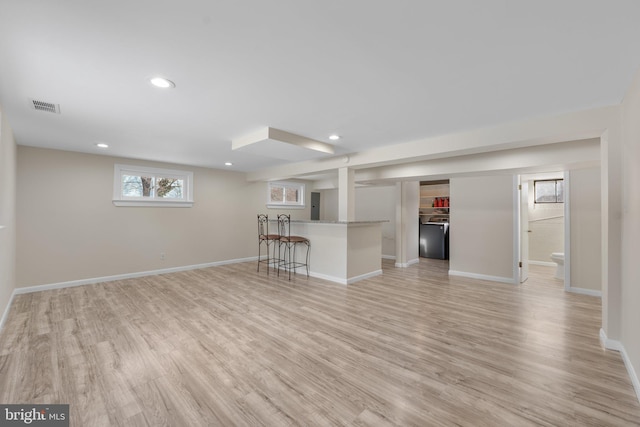 unfurnished living room featuring light wood-type flooring