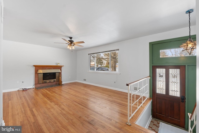 foyer with ceiling fan and hardwood / wood-style floors