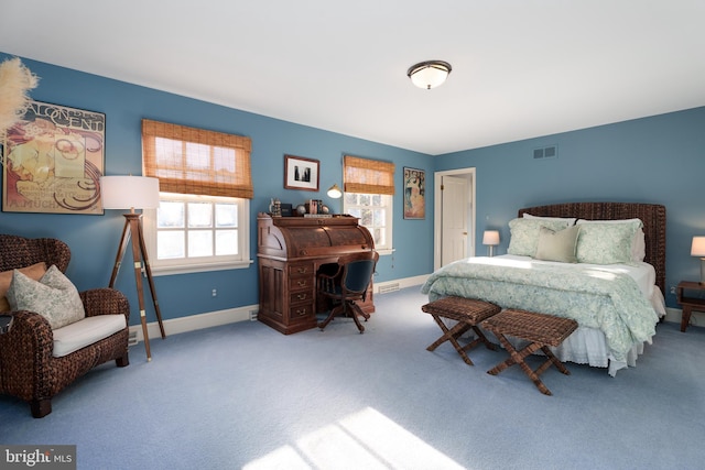 carpeted bedroom with visible vents and baseboards