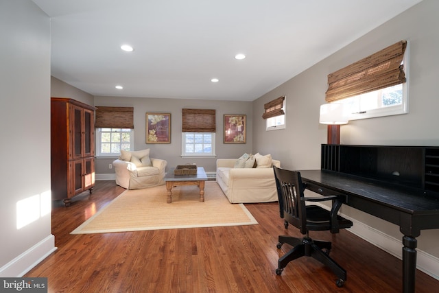 living area with recessed lighting, wood finished floors, and baseboards