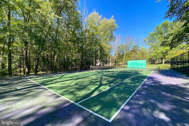 view of sport court with fence