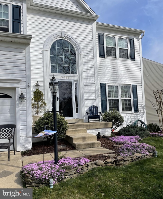 view of exterior entry featuring a garage