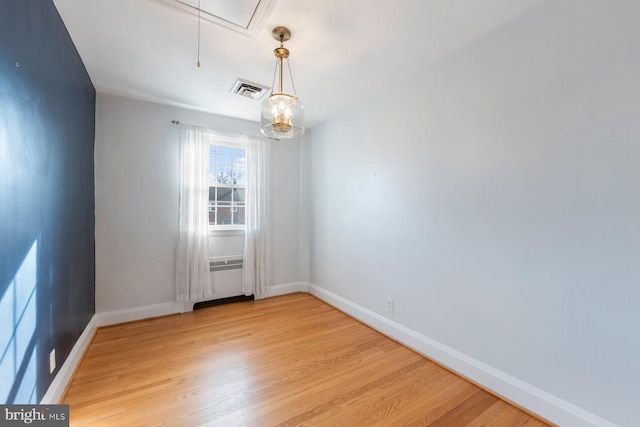 unfurnished room with light wood-type flooring