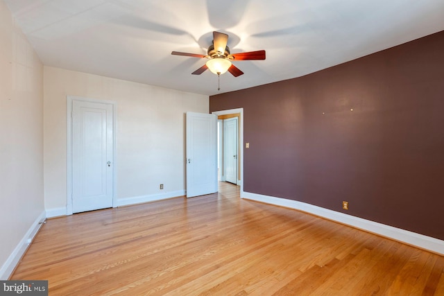 unfurnished room featuring ceiling fan and light wood-type flooring