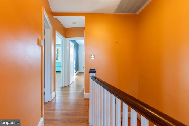 corridor with light wood-type flooring