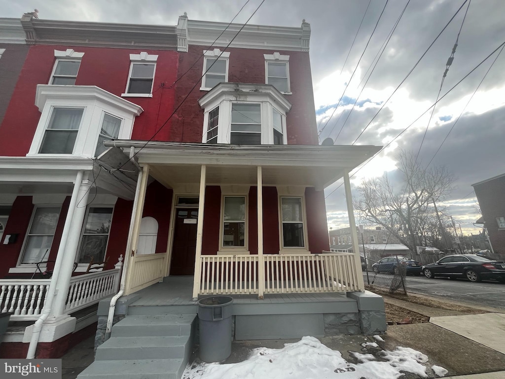 view of property featuring a porch