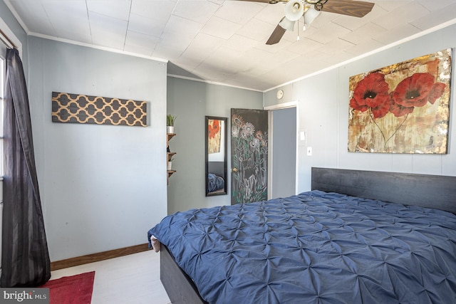 bedroom with ceiling fan and crown molding