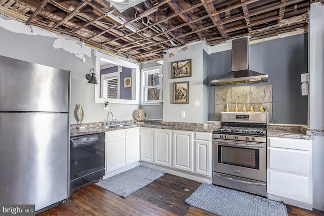 kitchen with wall chimney range hood, sink, white cabinetry, stainless steel appliances, and dark hardwood / wood-style flooring