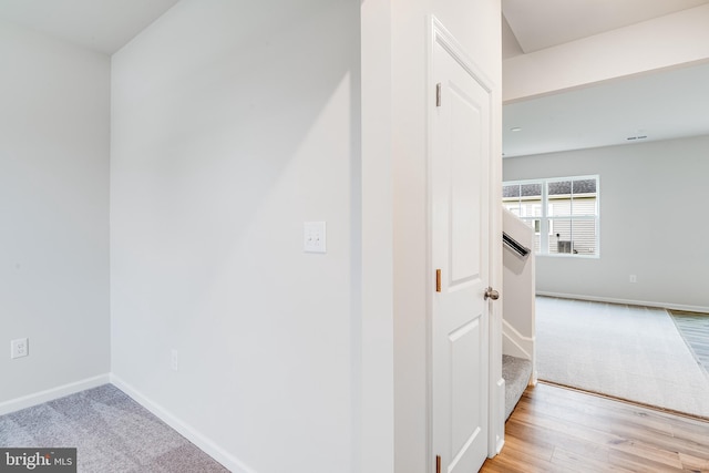 hallway with light carpet