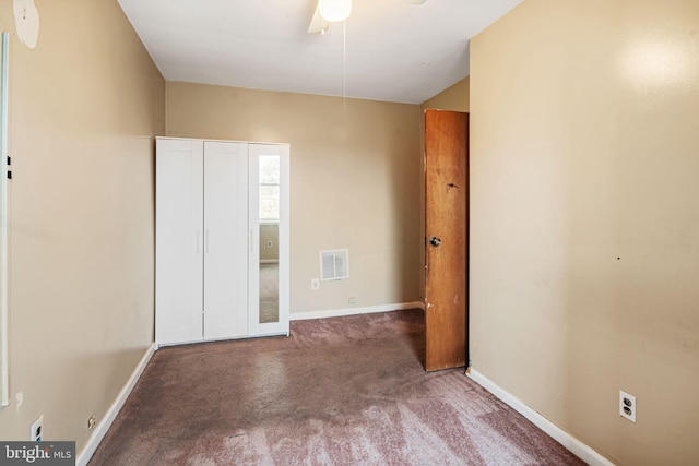 unfurnished bedroom featuring ceiling fan and carpet flooring