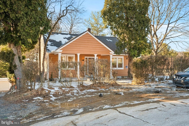 bungalow-style home with a porch