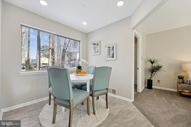 dining area with light carpet