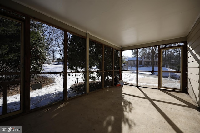 unfurnished sunroom featuring plenty of natural light