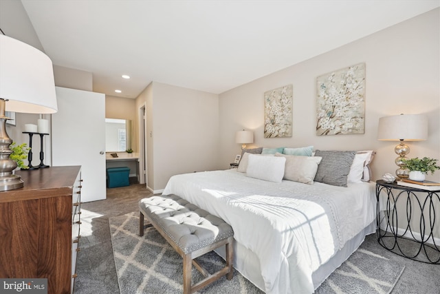 carpeted bedroom with ensuite bath