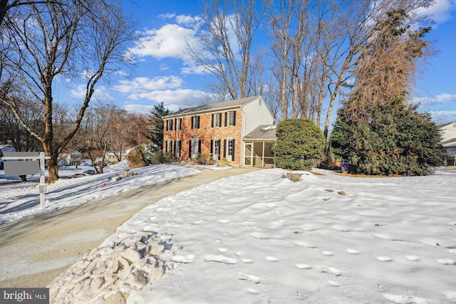 view of front of home with a sunroom