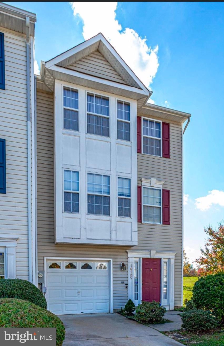 multi unit property featuring a garage