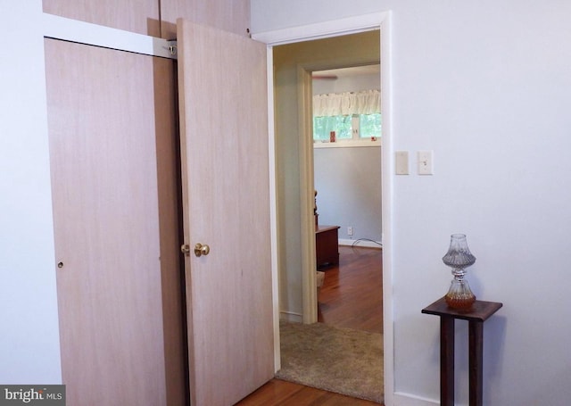 corridor featuring light hardwood / wood-style floors