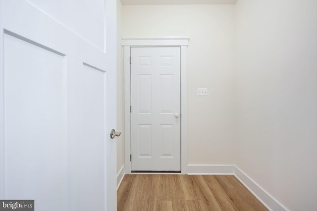 corridor featuring light hardwood / wood-style floors