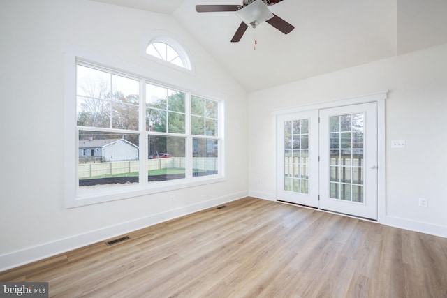 spare room with vaulted ceiling, ceiling fan, and light hardwood / wood-style floors