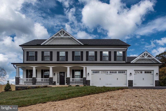 craftsman-style house with a porch and a front yard