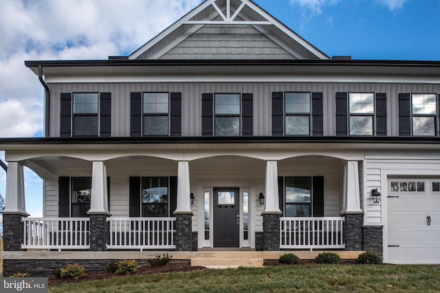 view of front of home featuring a garage and covered porch