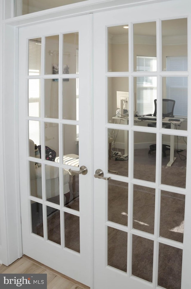 room details featuring french doors and hardwood / wood-style floors