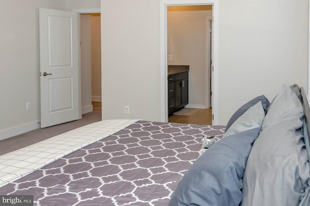 bedroom featuring ensuite bathroom