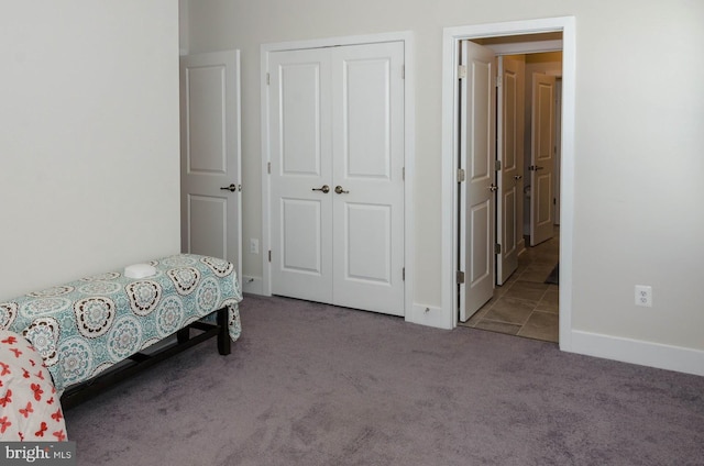 bedroom with carpet floors and a closet