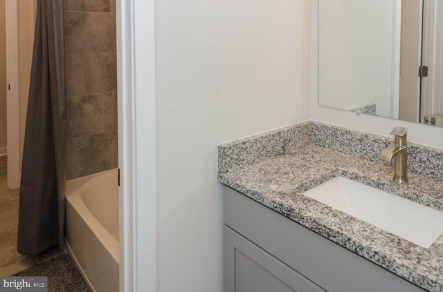 bathroom with vanity and shower / bath combo with shower curtain