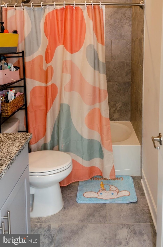 full bathroom with shower / tub combo with curtain, vanity, and toilet