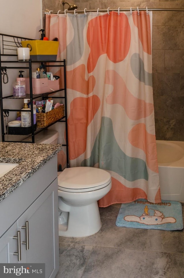 full bathroom with vanity, shower / bath combination with curtain, and toilet