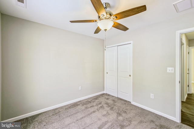 unfurnished bedroom featuring light carpet, a closet, and ceiling fan