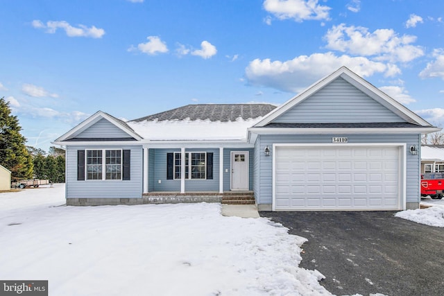 ranch-style house featuring a garage