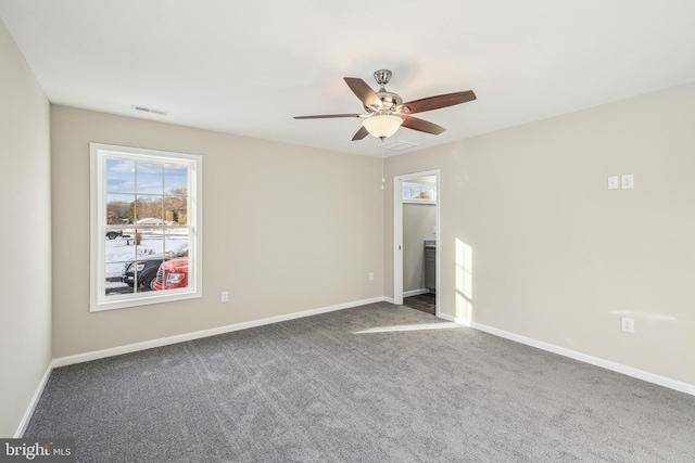 carpeted empty room featuring ceiling fan