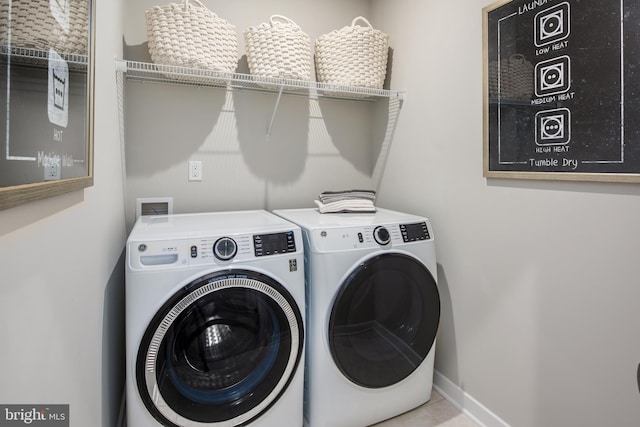 laundry room with independent washer and dryer