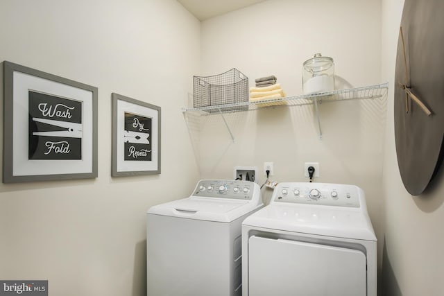 laundry room featuring washer and clothes dryer