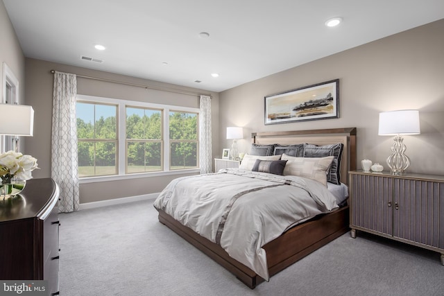 bedroom featuring light colored carpet