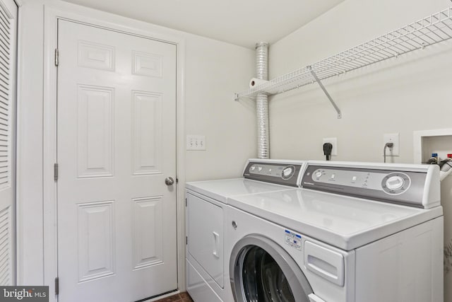 clothes washing area with independent washer and dryer