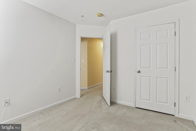 unfurnished bedroom with light carpet