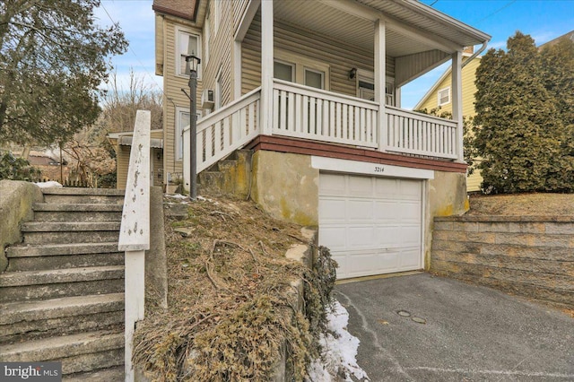 view of side of property with a garage