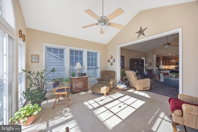 sunroom / solarium with ceiling fan and lofted ceiling