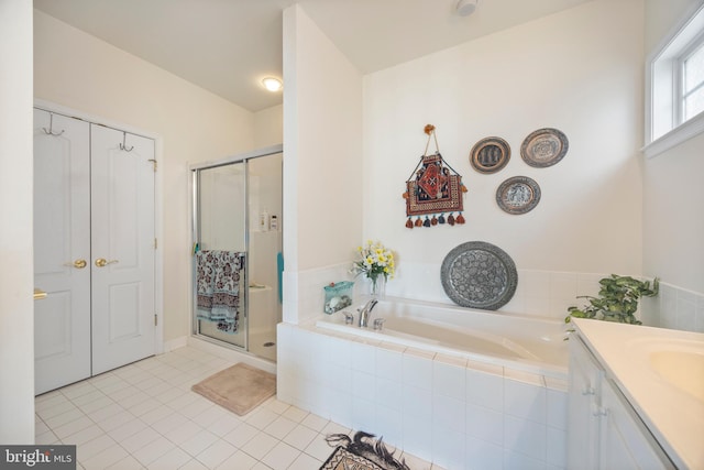 bathroom with vanity, tile patterned floors, and separate shower and tub