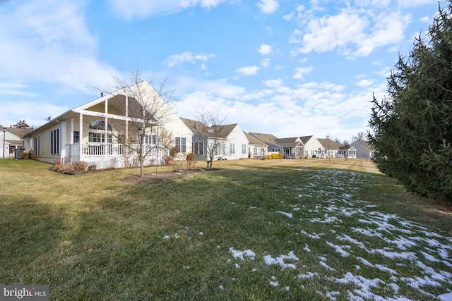 view of yard featuring covered porch