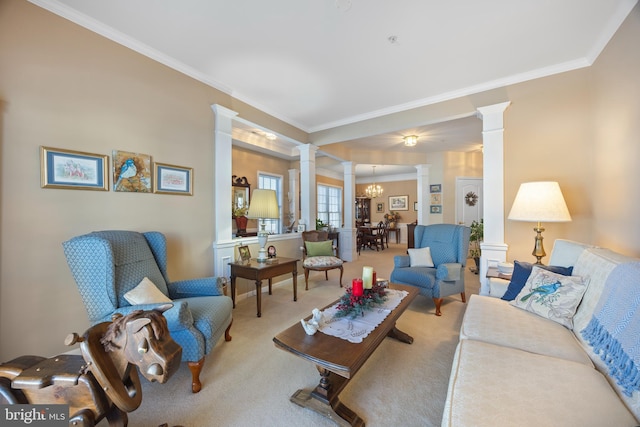 carpeted living room featuring ornate columns and ornamental molding