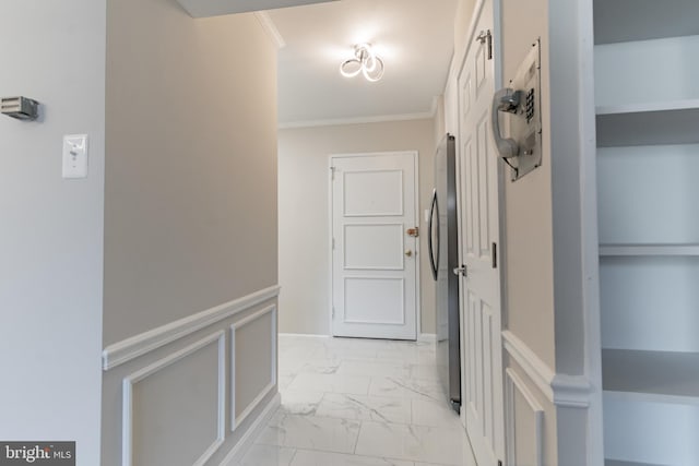 corridor featuring crown molding