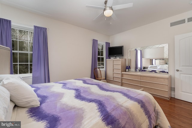 bedroom with ceiling fan and wood-type flooring