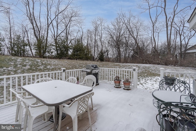 snow covered patio featuring area for grilling